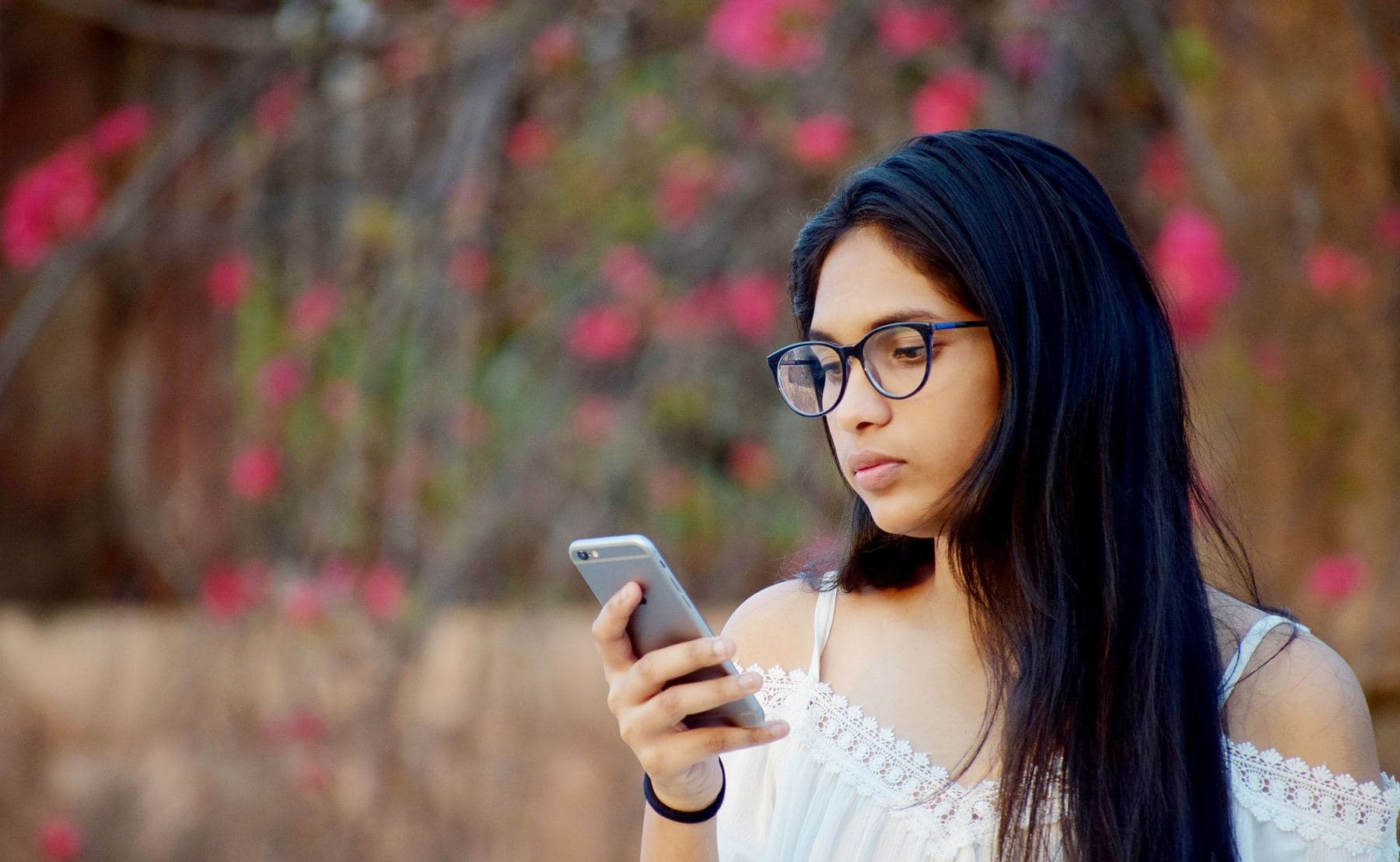 A young woman searching on her phone