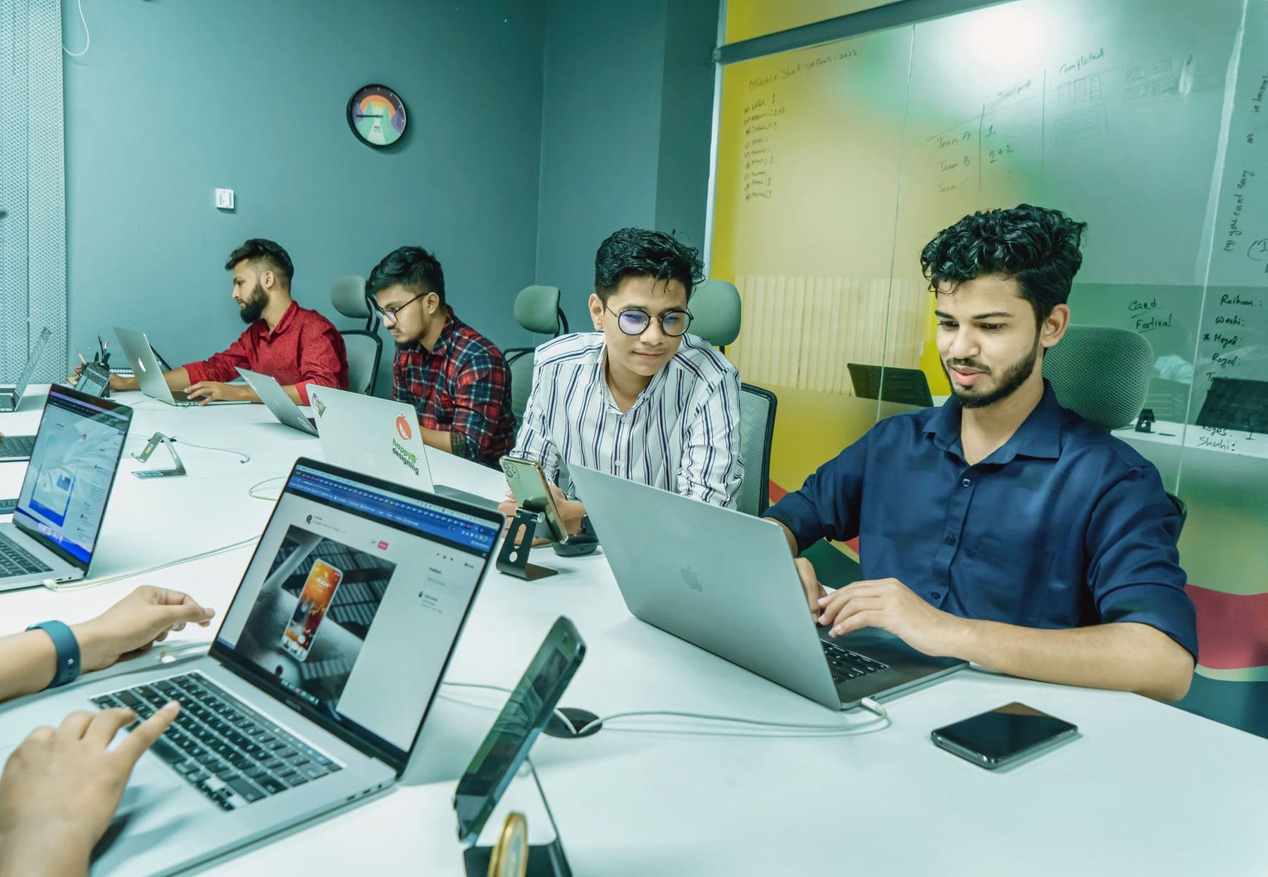 A small team working on laptops